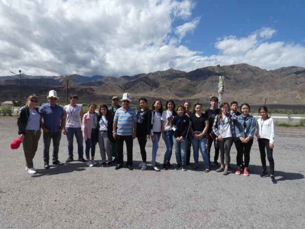 Summer Camp 2019 Children from Summer Camp standing as a group in front of the mountains