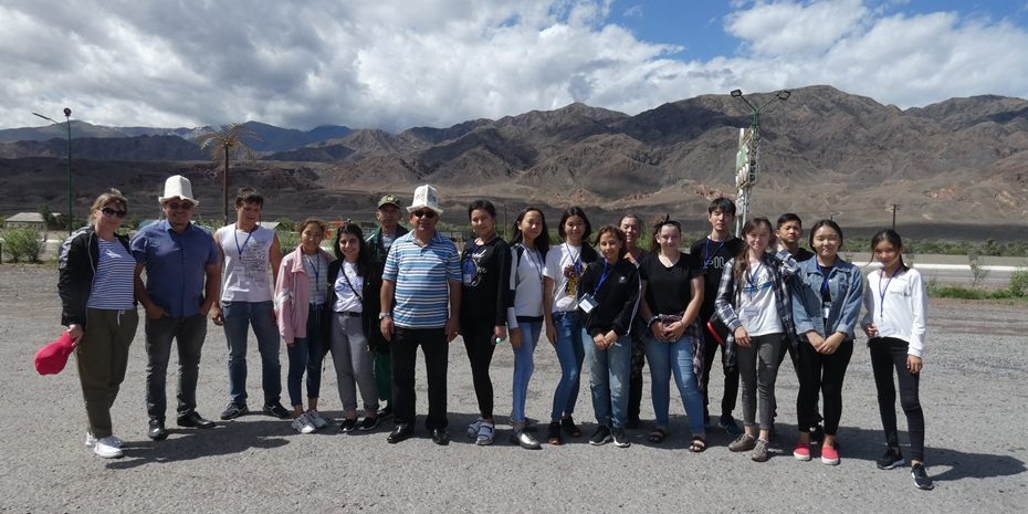 Summer Camp 2019 Children from Summer Camp standing as a group in front of the mountains