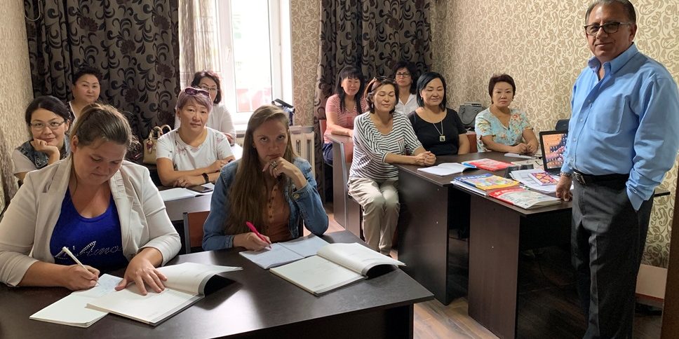Women’s English Class Nick with a group of women studying English in a classroom